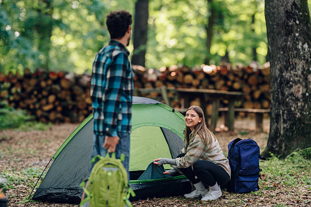 istock Young couple enjoying camping in forest 2216842556