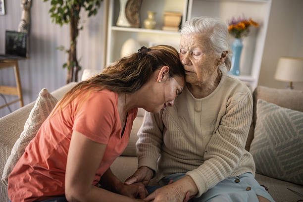 istock The daughter has family problems and her elderly mother comforts her. 2216842626