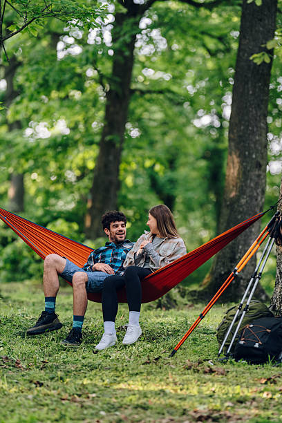 istock Hikers relaxing in hammock after hiking in forest 2216842794