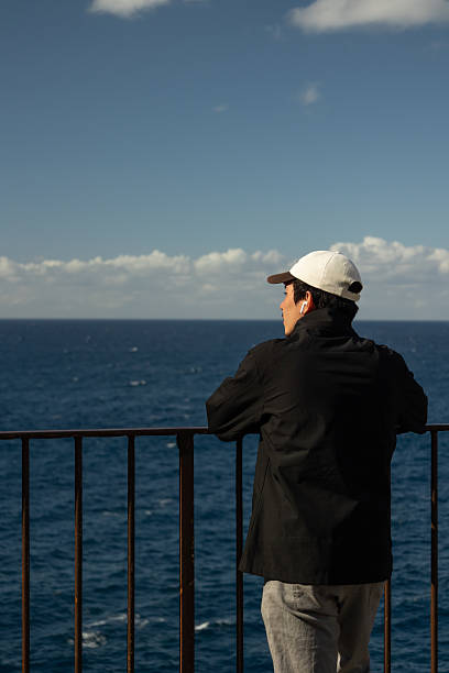 istock Vertical image of a man observing the Mediterranean Sea 2216843643
