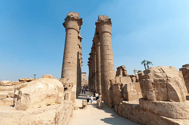 Views of ancient Egyptian architecture and hieroglyphs at historic sites in Luxor, showcasing temples, statues, columns, and intricate carvings.