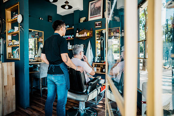 Barber attending to customer in a modern barbershop, creating a relaxed and enjoyable grooming experience