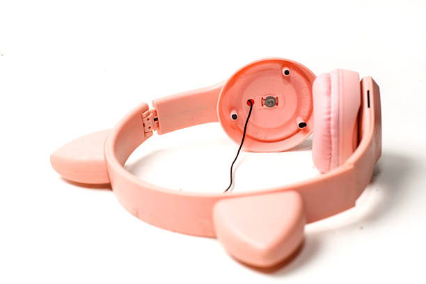 istock broken pink headphones, isolated on white background 2216848295