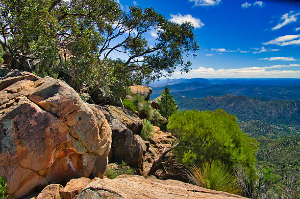 View from Tanderra Saddle along the St Mary Peak Hike, Wilpena Pound, Flinders Ranges, South Australia, with huge boulders in the foreground