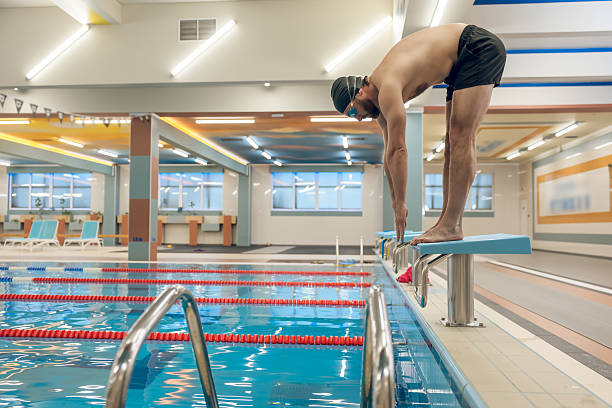 istock Man having a workout in the swimming pool 2216859657