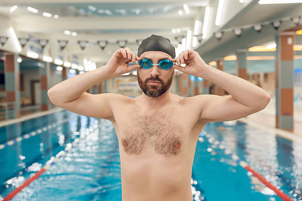 Exercising. Man having a workout in the swimming pool