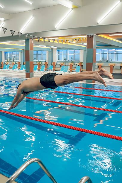 istock Man having a workout in the swimming pool 2216859819