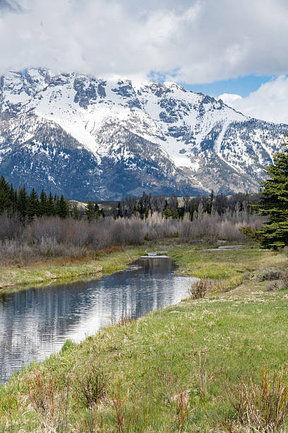 istock Reflection in Snake River with Grand Teton mountain peaks on spring day 2216860549
