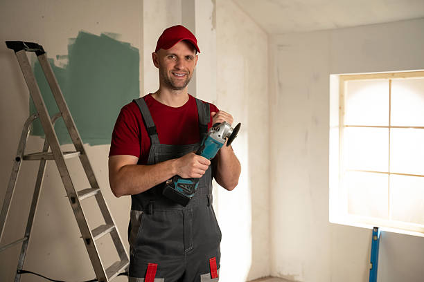 istock Construction worker holding angle grinder in renovated room 2216874810