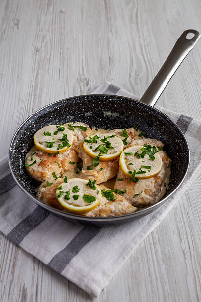 istock Homemade Creamy Lemon Chicken in a Pan, side view. 2216876091