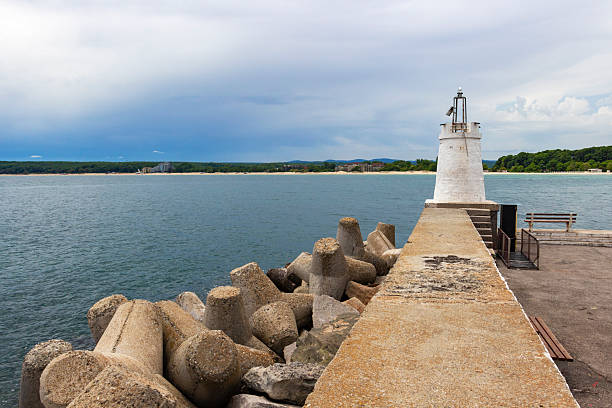 istock Lighthouse and breakwater under dramatic sky on the Bulgarian Black Sea Coast 2216884533