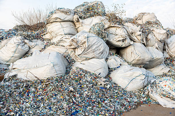 istock Piles of Plastic Waste and Discarded Bottles in Oversized Sacks 2216886288