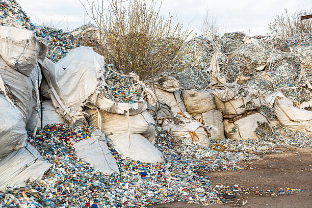 istock Plastic Waste and Old Bottles Scattered Among Sparse Vegetation 2216886292