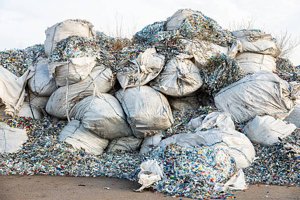 istock Stacks of Weathered Sacks Filled with Shredded Plastic Waste 2216886305