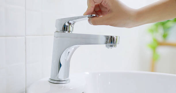 istock asian people turning off faucet 2216887251