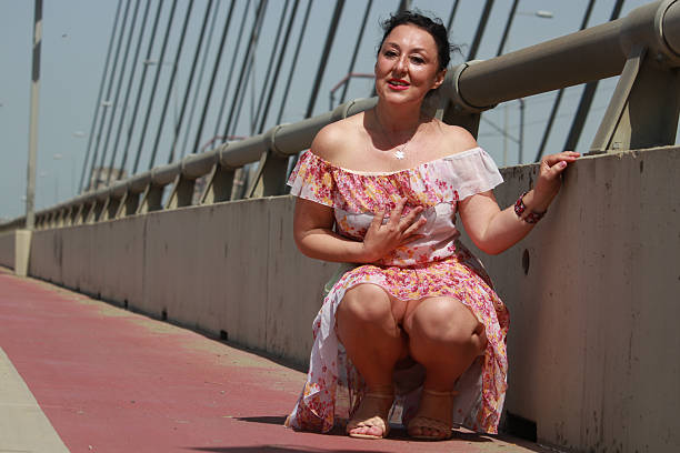 sunny day wind attractive dress bridge bicycle active lifestyle