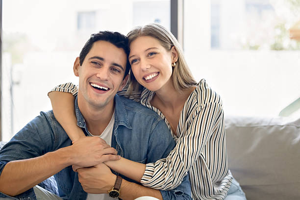 istock Cheerful young Hispanic husband and wife hugging with love 2216888626