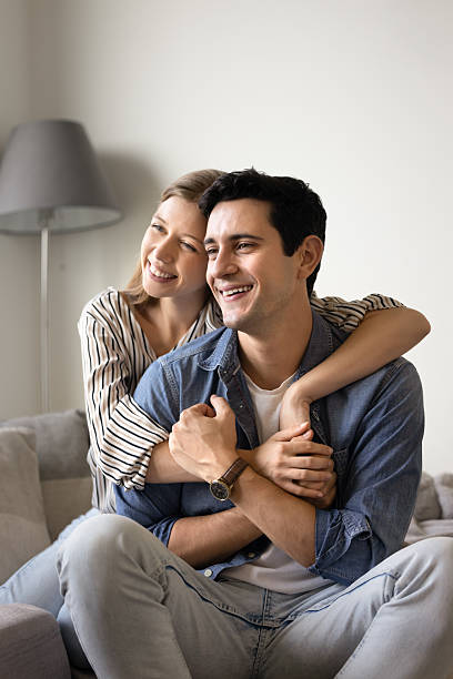 istock Happy young Latin couple hugging with love 2216888706