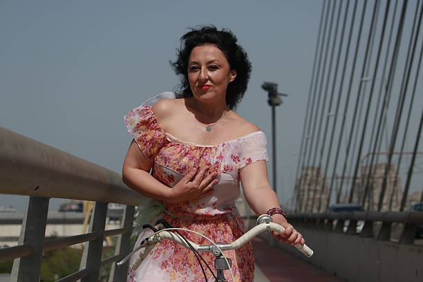 sunny day wind attractive dress bridge bicycle active lifestyle