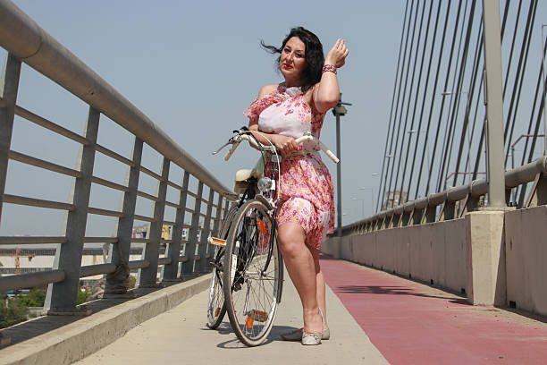 istock Modern mature woman on bridge in wind day 2216888853