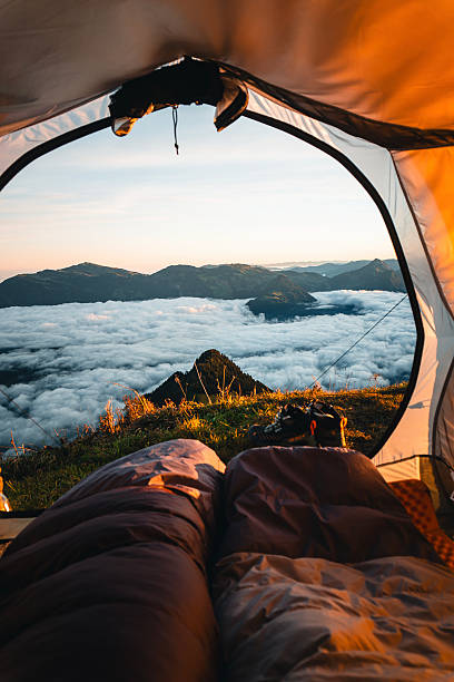 istock View past sleeping bag in tent to snowcapped mountains at sunset 2216889306