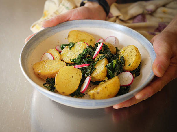 A cozy vegan spring potato salad made with tender baby potatoes, sautéed garlic, miso paste, and cavolo nero
