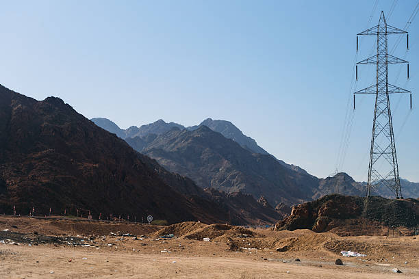 istock Expansive Desert Landscape Featuring Majestic Mountains and Abandoned Structures in Full View 2216891163