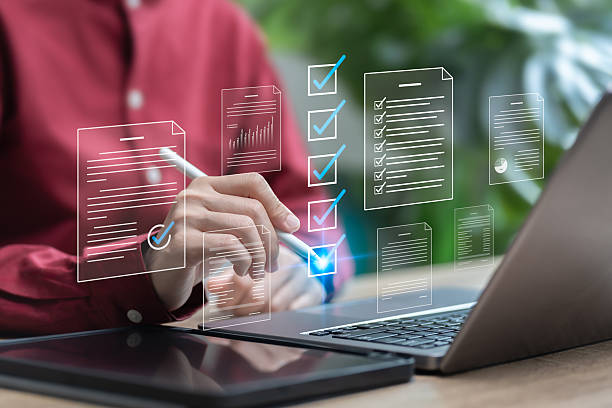 istock Document management,Online digital checklist concept, Businesswomen check electronic documents,Digital documents, Graph show online survey results,Customer satisfaction feedback automation efficiently 2216893792