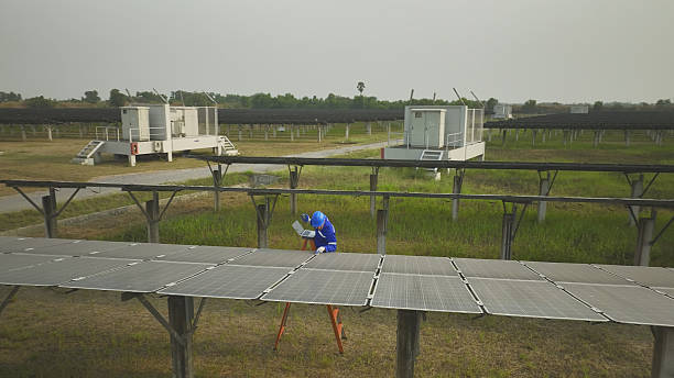 View from above shows engineers inspecting a solar farm