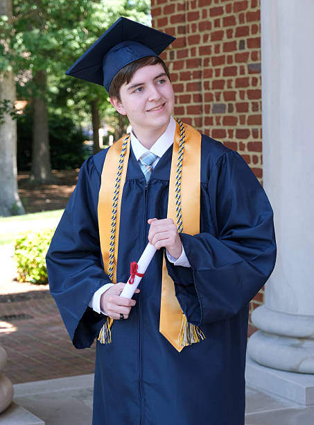 istock High school senior cap and gown portraits 2216895572