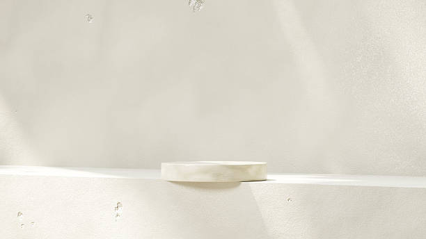 istock Minimal product display scene with a concrete backdrop and warm sunlight casting natural shadows. 2216898515