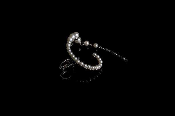 istock pearl bracelet on black background 2216900288