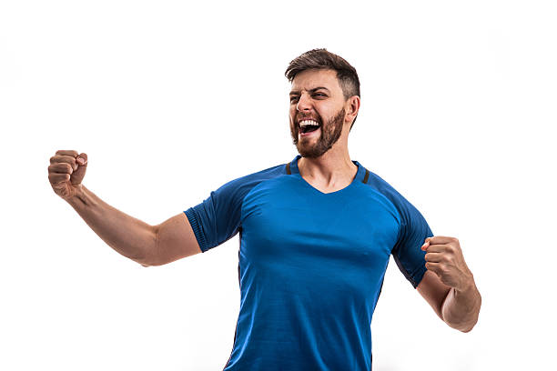 Excited man celebrating with clenched fists and shouting