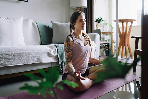 istock Woman practicing Yoga inside of a room 2216902653