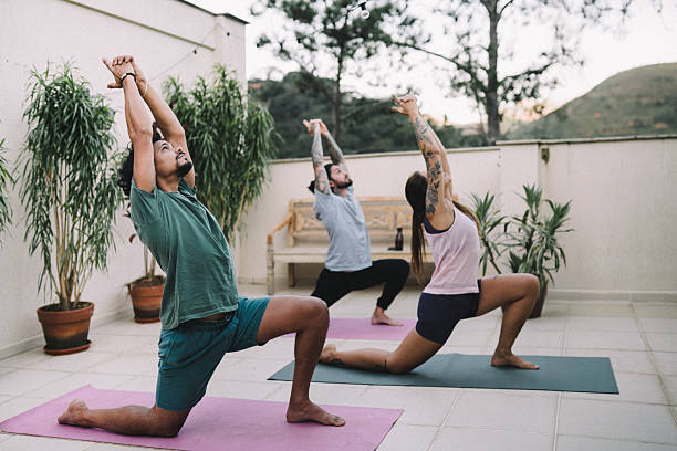 istock Group of friends practicing Yoga in the backyard 2216902655