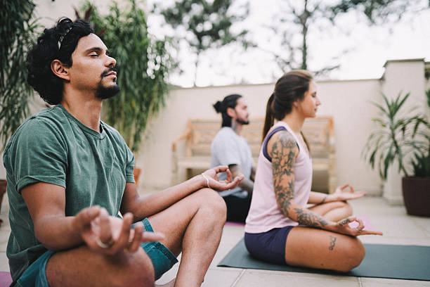 istock Group of friends practicing Yoga in the backyard 2216902666