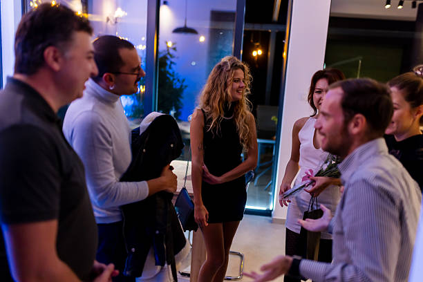 istock A social gathering in an inviting indoor space emphasized by a warm and friendly interaction among attendees. 2216906943