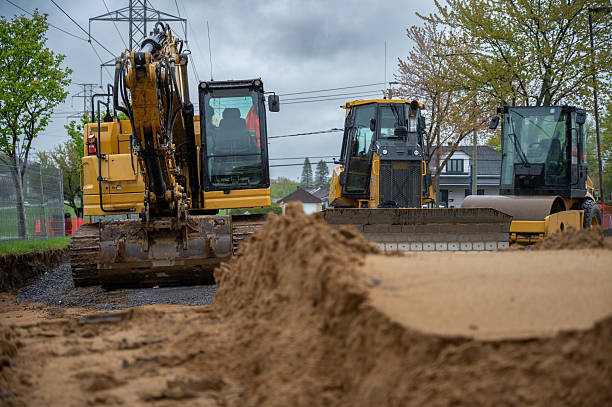 istock Road repair site and excavator 2216910193