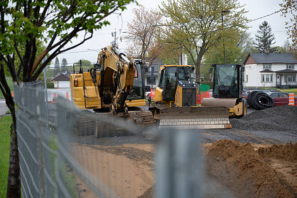 istock Road repair site and excavator 2216910284