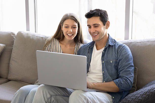 istock Happy young Latin couple using modern Internet technology at home 2216914193
