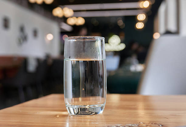 istock glass of water on table in restaurant 2216914655