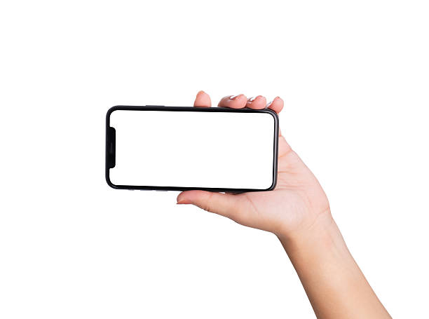 istock Hand holding the black smartphone with blank screen isolated on white background, clipping path. 2216914878