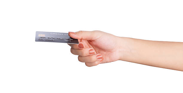 istock Female hand hold credit card isolated on white background, clipping path. 2216915547