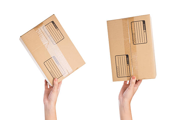 istock Hand holding parcel Box isolated on white background, clipping path. 2216915622