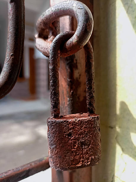 istock Aged rusty padlock showing textures of corrosion and time passage. 2216915825