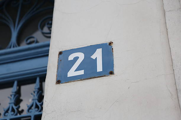istock European Address Plaque with Blue Wrought Iron Gate in Background 2216919109