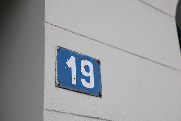 A rectangular blue sign displaying the number \