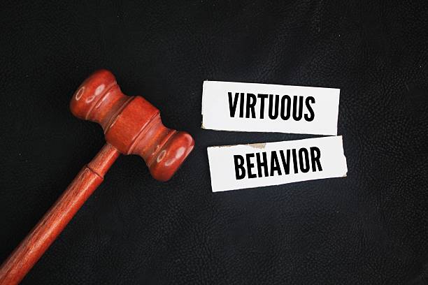 istock Judge's gavel and white paper with the words virtuous behavior. also known as righteous conduct or ethical actions 2216919180