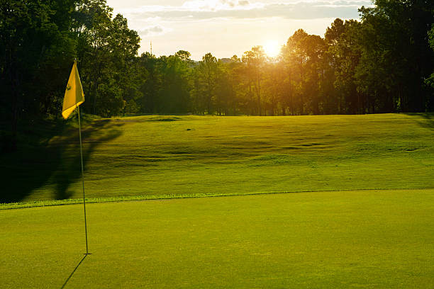 istock Beautiful golf course in a sunny day. Background evening golf course has sunlight shining down. 2216919694