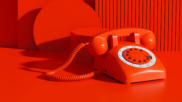 A vibrant 3D render featuring a classic red rotary telephone set against a bold, monochromatic red background with geometric platforms and a ribbed wall texture. This retro style still life evokes nostalgia and the era of landline phone communication. The clean, modern art aesthetic highlights the iconic design of the vintage telephone, making it suitable for themes of connection, conversation, or as a decorative graphic print. The strong lighting and shadows add depth to this striking composition.